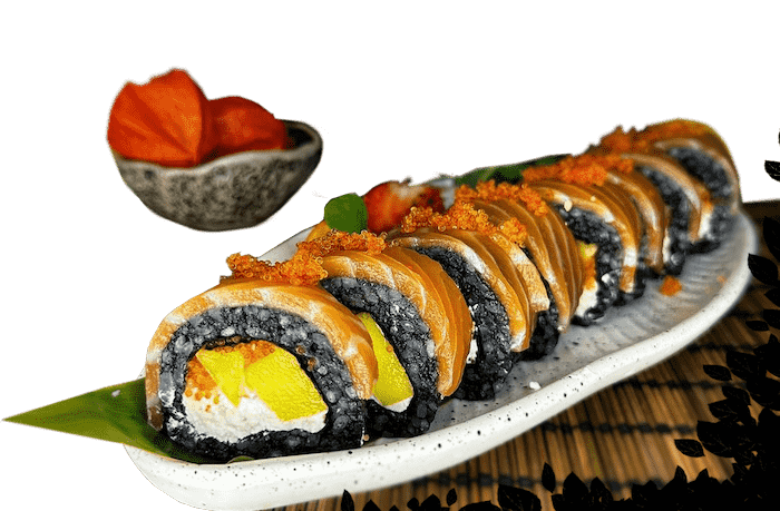 A sushi roll sits elegantly on a white plate, featuring black rice, salmon, cream cheese, and mango slices crowned with orange roe. In the background, a small bowl with vibrant orange fruit echoes the colorful charm of Edinburgh's culinary delights.