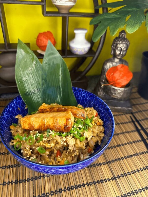 Aromatic Japanese Fried Rice with succulent salmon pieces, ready to delight the senses