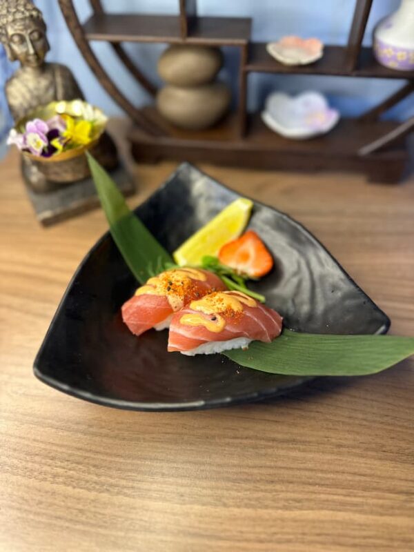 Artisan Nigiri Tuna, beautifully presented on a black plate, epitomizes Edinburgh sushi craftsmanship