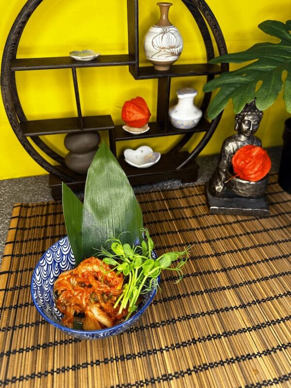 Authentic Korean Kimchi Cabbage served in a decorative bowl, ready to be enjoyed with a meal