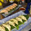 Close-up of Gyoza Duck appetizer on blue and white dishware, Edinburgh restaurant