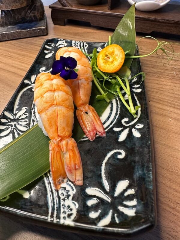 Close-up of Nigiri Shrimp sushi, highlighting the craftsmanship of Edinburgh's sushi chefs.