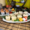 Close-up of Tartarus with Sea Scallop sushi pieces, drizzled with creamy mayonnaise and sprinkled with chives, a taste of the sea from Edinburgh