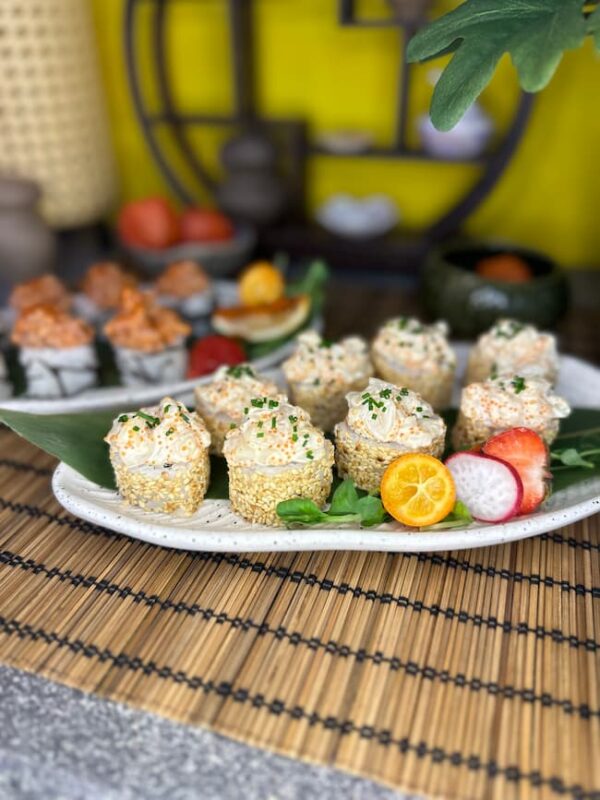 Close-up of Tartarus with Sea Scallop sushi pieces, drizzled with creamy mayonnaise and sprinkled with chives, a taste of the sea from Edinburgh