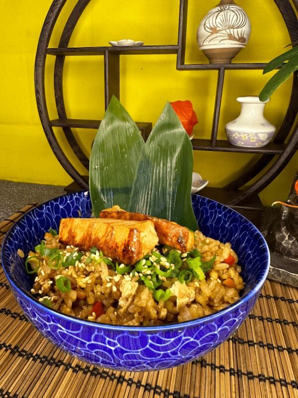 Hearty serving of Japanese Fried Rice with Salmon, a fusion of traditional Asian flavors