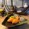 Experience authentic Japanese gastronomy with our Nigiri Salmon, nestled on a bed of seasoned rice.