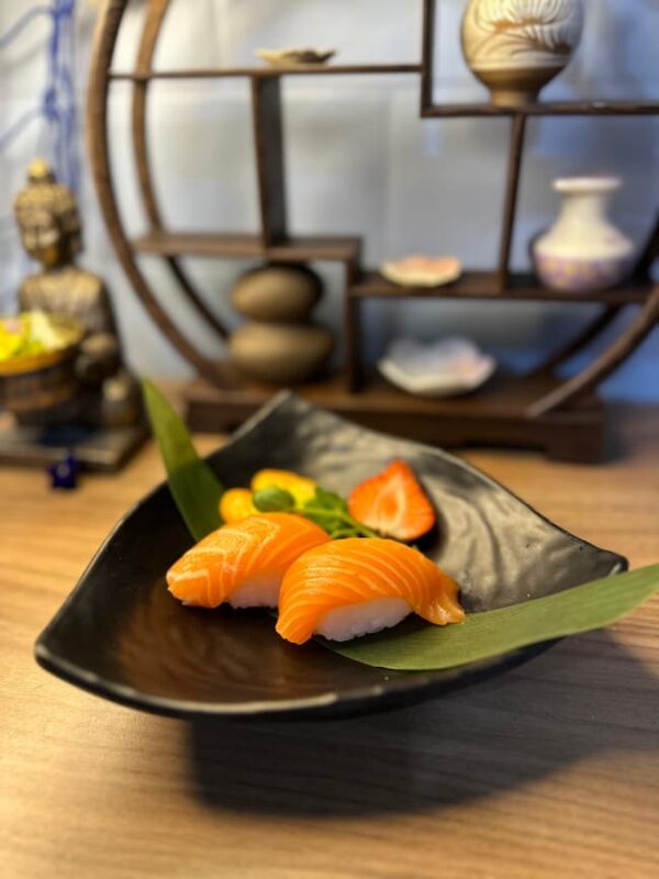 Experience authentic Japanese gastronomy with our Nigiri Salmon, nestled on a bed of seasoned rice.