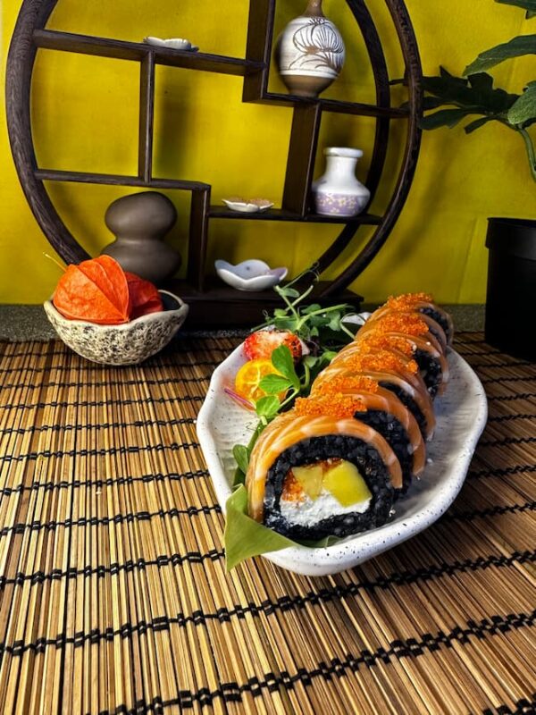 Indulge in the art of sushi with Edinburgh's Phila Mango Black, a fusion of tropical mango and rich salmon on seasoned rice