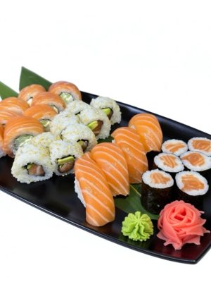 Salmon Lover Sushi set featuring sushi rolls, nigiri, wasabi, and pickled ginger on a black plate against a white background.