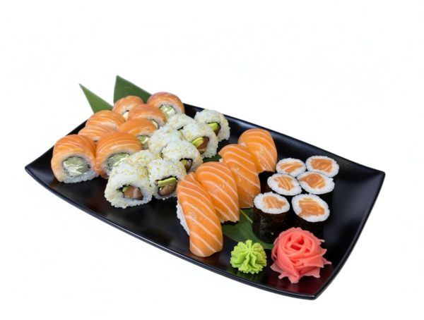Salmon Lover Sushi set featuring sushi rolls, nigiri, wasabi, and pickled ginger on a black plate against a white background.