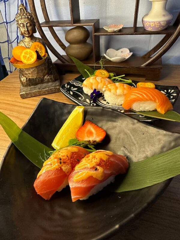 Rich Nigiri Tuna slices on sushi rice, a sophisticated snack showcasing Edinburgh's culinary finesse