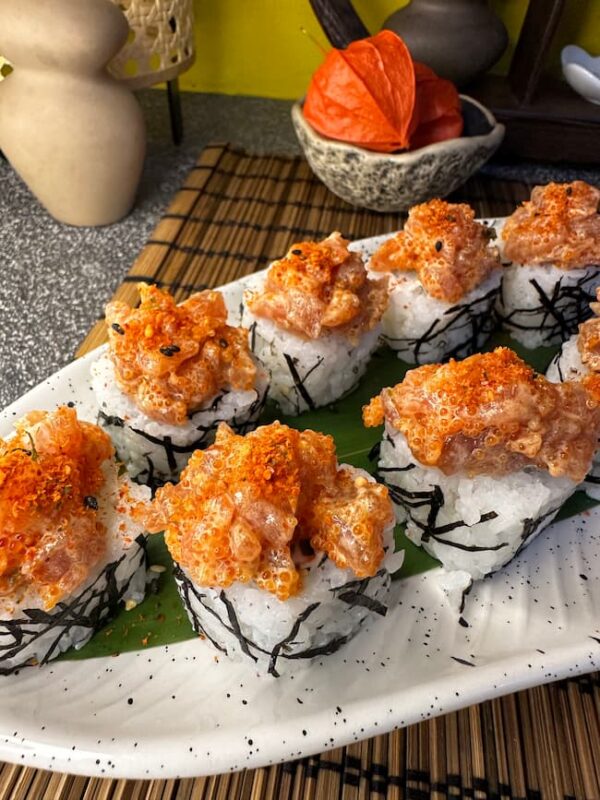 Spicy Tuna Tartarus sushi with fiery sauce and tobiko on a bed of rice, an Edinburgh sushi specialty