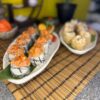 Table setting in Edinburgh showcasing Spicy Tuna Tartarus sushi rolls, a harmonious blend of spicy tuna and creamy avocado