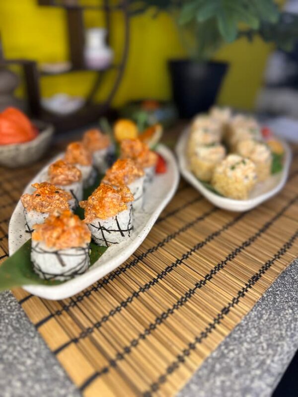 Table setting in Edinburgh showcasing Spicy Tuna Tartarus sushi rolls, a harmonious blend of spicy tuna and creamy avocado