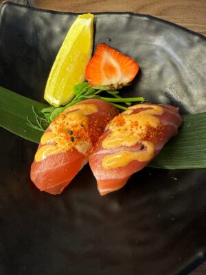 Tantalizing Nigiri Tuna sushi, seasoned with a spicy kick, ready to enjoy in Edinburgh