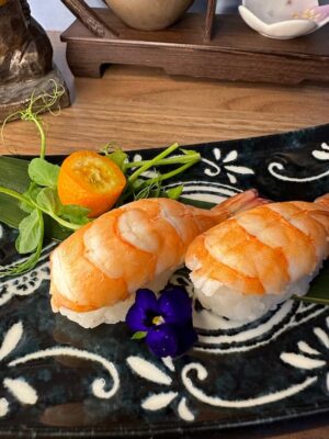 Traditional Nigiri Shrimp with soy and wasabi, a testament to Edinburgh's sushi artistry.