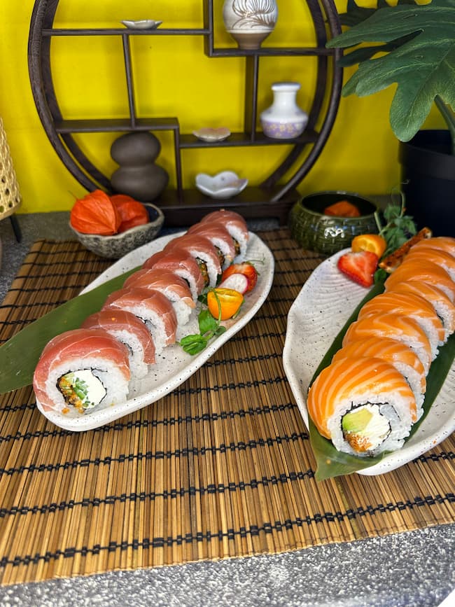 Up-close view of Philadelphia with Salmon sushi, showcasing the creamy cheese and tobiko topping, ready to enjoy in Edinburgh