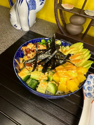 Close-up of Tuna Poke bowl showcasing tuna and mango