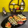 Close-up of salmon and tuna nigiri with sesame and tobiko on California Sushi Platter in Edinburgh.