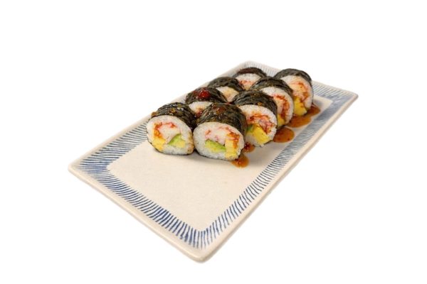 Eight Futomaki Crab Sweet Chili rolls with seaweed, rice, tuna, crab, egg & avocado, topped with sauce on a ceramic plate.