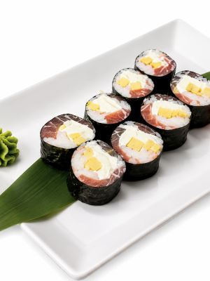 Eight No Rice Sushi Royal Mango Tuna Roll pieces with seaweed, egg, fish, mango, wasabi, ginger, and a green leaf on a plate.