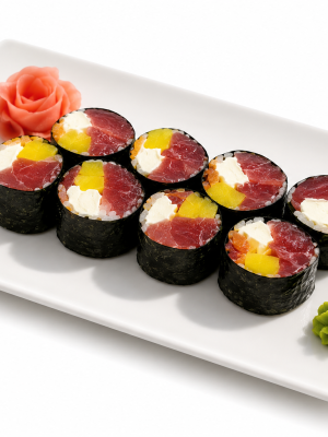 A rectangular plate with six No Rice Sushi Emerald Rolls, plus pickled ginger and wasabi, on a white background.